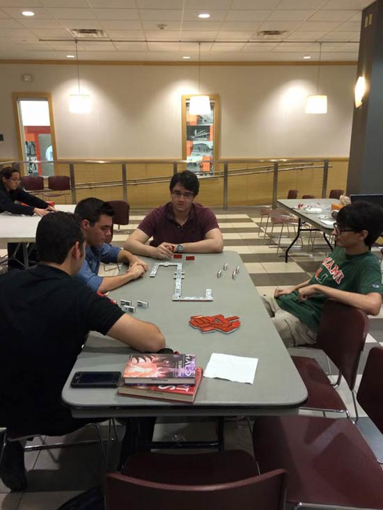 Members of the Association of Cuban-American Engineers (ACE) at UM often get together to play dominoes in the Engineering building.